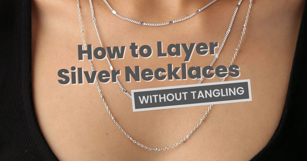 Layered silver necklaces showing different chain lengths worn without tangling