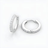 Sterling silver huggie hoop earrings with cubic zirconia are displayed against a plain white background.