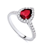 Sterling silver ring with a pear-shaped simulated ruby center, surrounded by a halo of cubic zirconia.