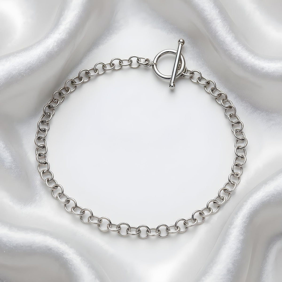 Silversmiths Sterling Silver bracelet featuring a 4mm T-Bar Belcher chain, shown in a simple, clear presentation.
