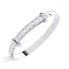 A sterling silver expanding baby bangle with heart cut-outs is displayed on a plain white background.