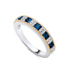 Two-tone gold plated silver ring featuring a row of simulated sapphires and beaded accents.