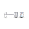 Sterling silver oval stud earrings with blue topaz stones set in a secure four-prong setting.