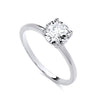 A sterling silver ring with a round cubic zirconia solitaire and a plain band, shown on a white background.