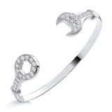 Sterling silver torque bangle with wrench-shaped open ends, each set with sparkling cubic zirconia stones.