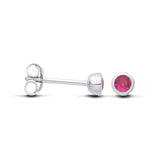 Silversmiths sterling silver simulated ruby stud earrings shown from the side and front against a white background.