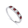 Sterling silver ring featuring a channel-set row of simulated ruby and cubic zirconia stones along the band.