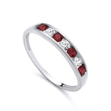Sterling silver ring featuring a channel-set row of simulated ruby and cubic zirconia stones along the band.