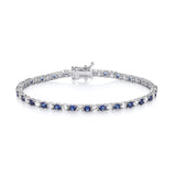 A sterling silver tennis bracelet with 3mm simulated sapphires and cubic zirconia, shown on a white background.