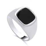 Sterling silver signet ring with a square black onyx cushion centerpiece by Silversmiths.
