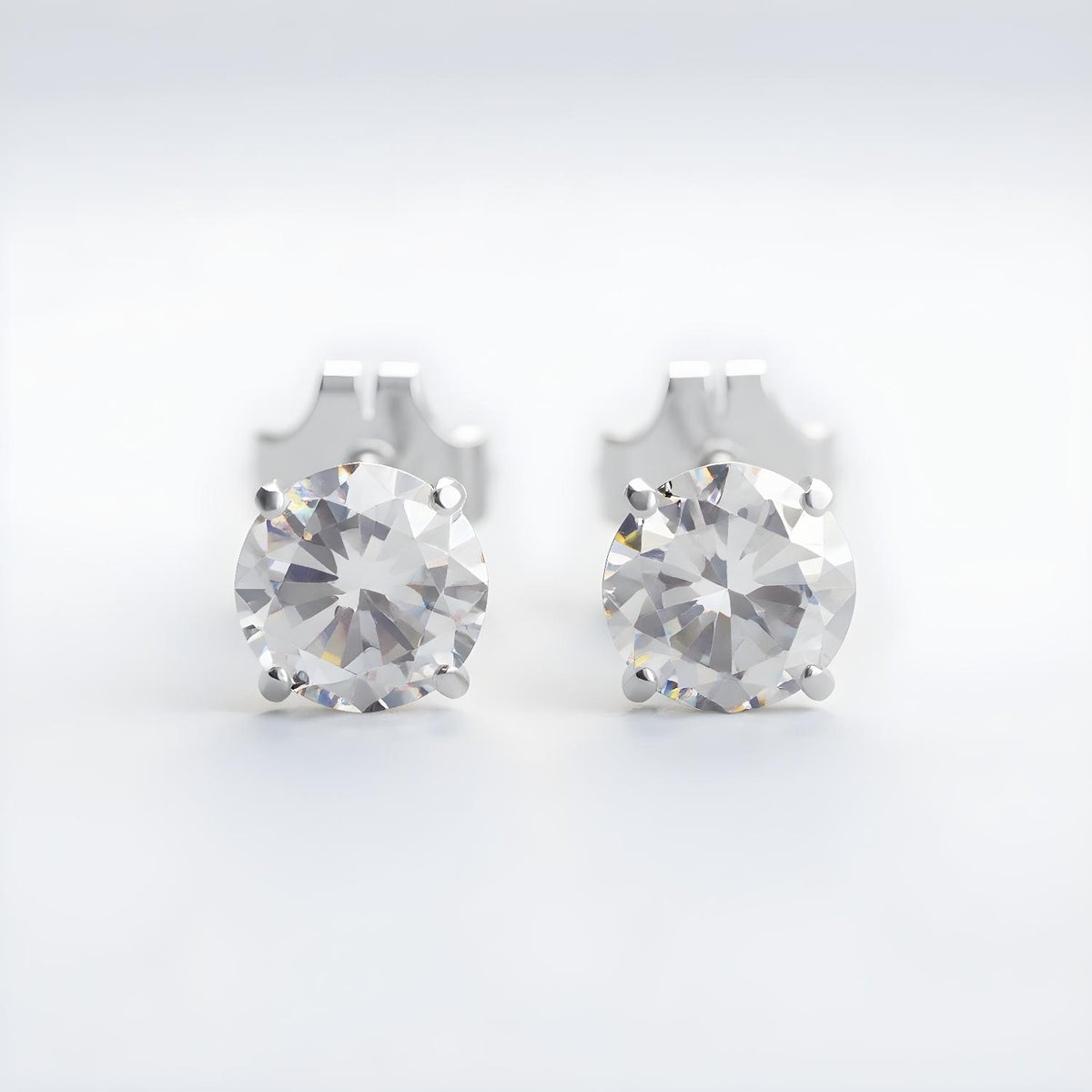 Silversmiths sterling silver stud earrings with 5mm round cubic zirconia stones.