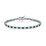 Sterling silver bracelet features 3mm simulated emeralds and cubic zirconia, displayed on a white background.