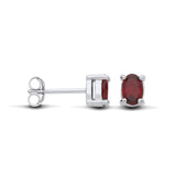 Sterling silver stud earrings feature oval natural garnets and butterfly backs, displayed from several viewpoints.