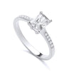 Sterling silver ring by Silversmiths with a 7x5mm emerald-cut cubic zirconia solitaire and accent stones.