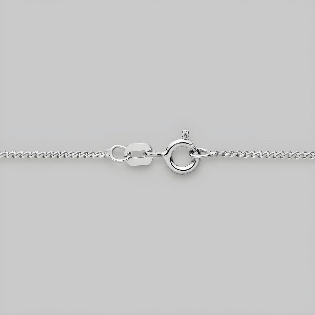 A 1.2mm sterling silver curb chain necklace with a spring ring clasp displayed on a plain gray background.