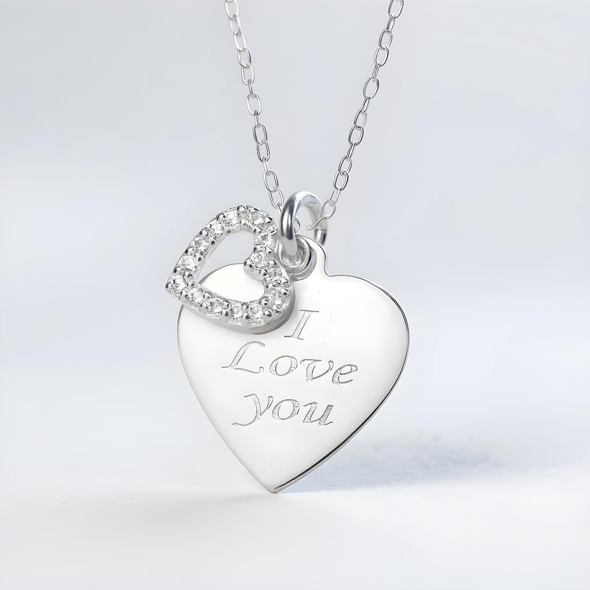 Sterling silver necklace with a heart-shaped “I Love You” charm and cubic zirconia on a fine sterling silver chain.