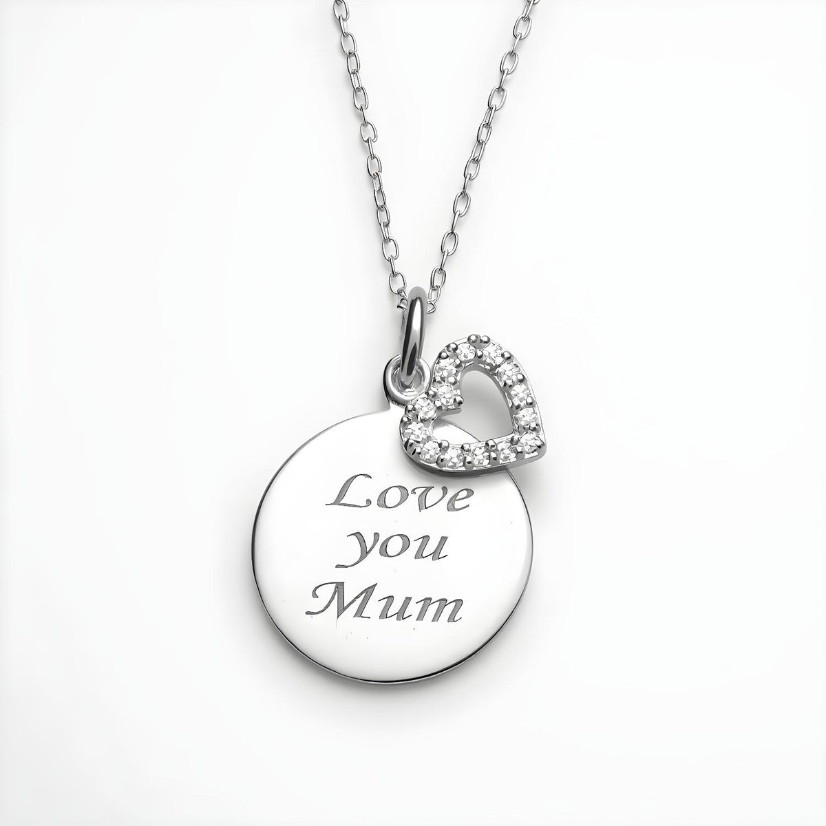 Silversmiths sterling silver necklace with a cubic zirconia heart and “Love You Mum” engraved disc charm.