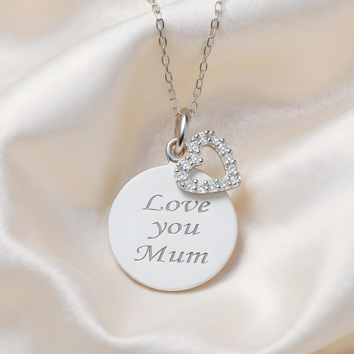 Silversmiths sterling silver necklace with cubic zirconia, featuring a “Love You Mum” disc and a heart charm.