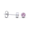 Sterling silver faceted simulated alexandrite bezel stud earrings shown from front and side on a white background.