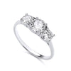 Sterling silver three-stone ring by Silversmiths features round cubic zirconia on a plain band.