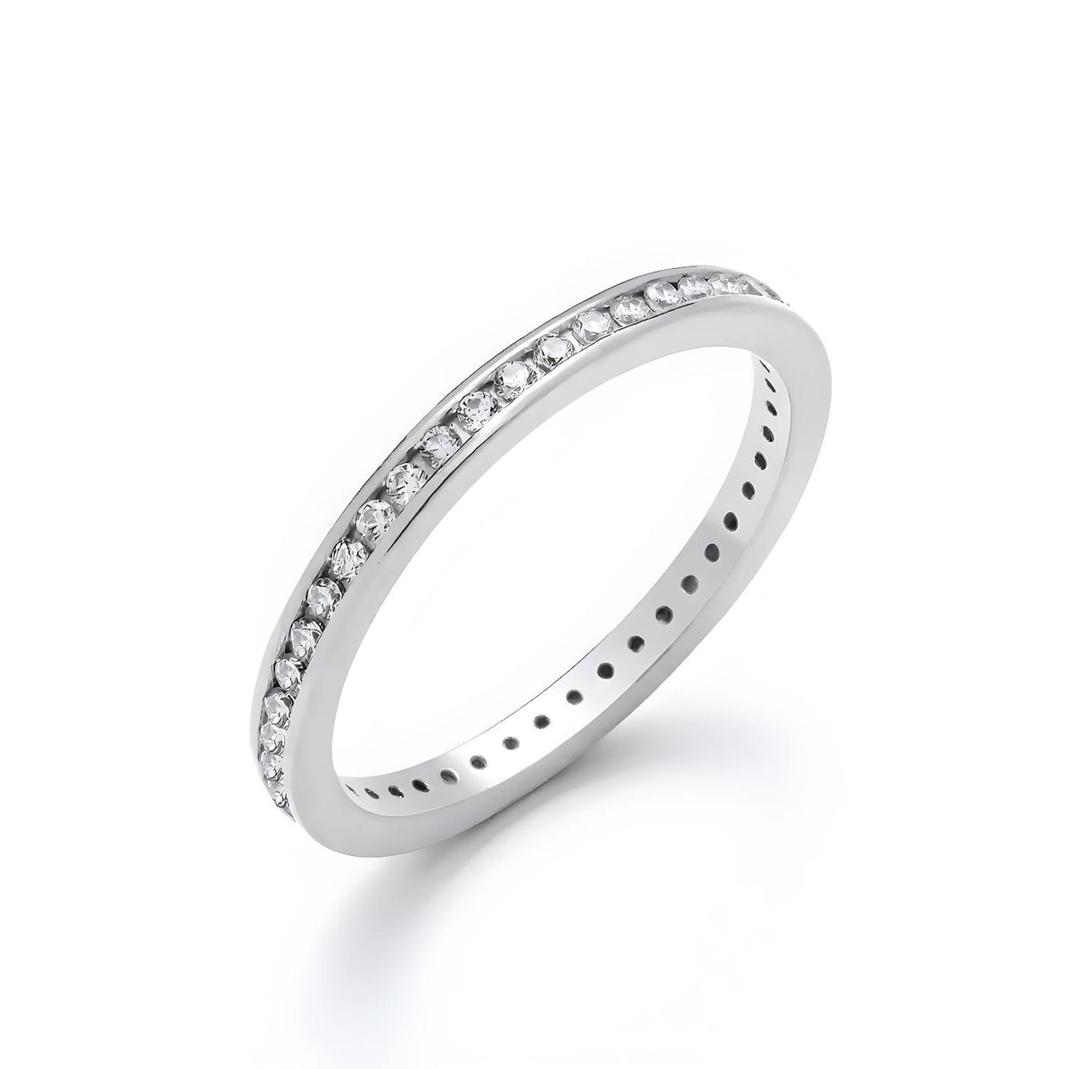Silversmiths’ sterling silver eternity ring has round cut CZ stones channel set along a smooth, polished band.