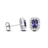 Sterling silver stud earrings with emerald-cut simulated tanzanite stones, halo setting, and butterfly backs.