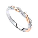 Two-tone twisted eternity ring with rose gold and silver bands, set with sparkling cubic zirconia stones.