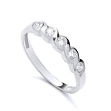 Sterling silver eternity ring with five bezel-set cubic zirconia stones on a wavy, polished band.