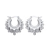 Sterling silver 20.5mm gypsy creole hoop earrings feature spiked edges and secure lever-back clasps.