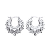 Sterling silver 20.5mm gypsy creole hoop earrings feature spiked edges and secure lever-back clasps.