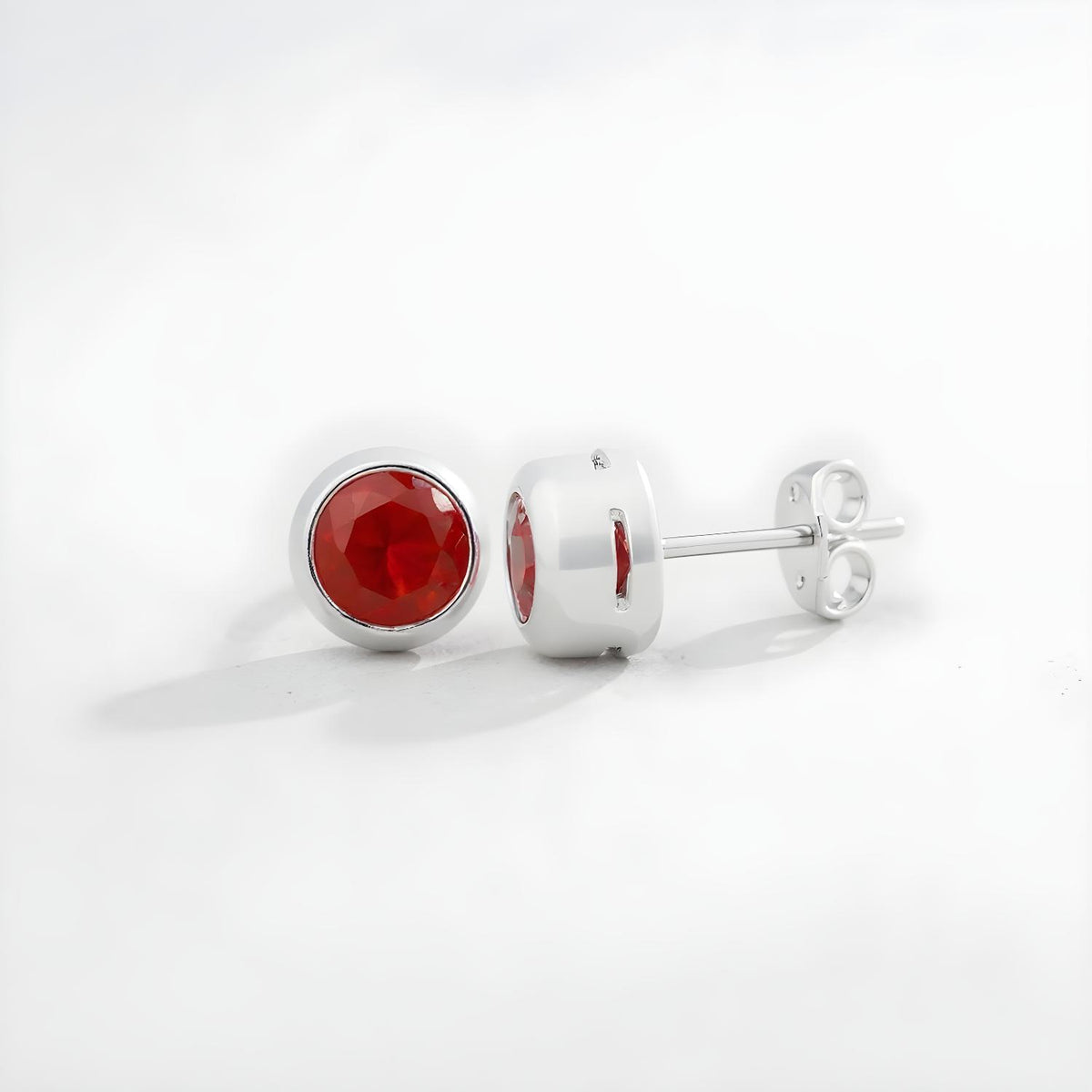 Silversmiths sterling silver stud earrings with simulated tourmaline, displayed front and side on a white background.