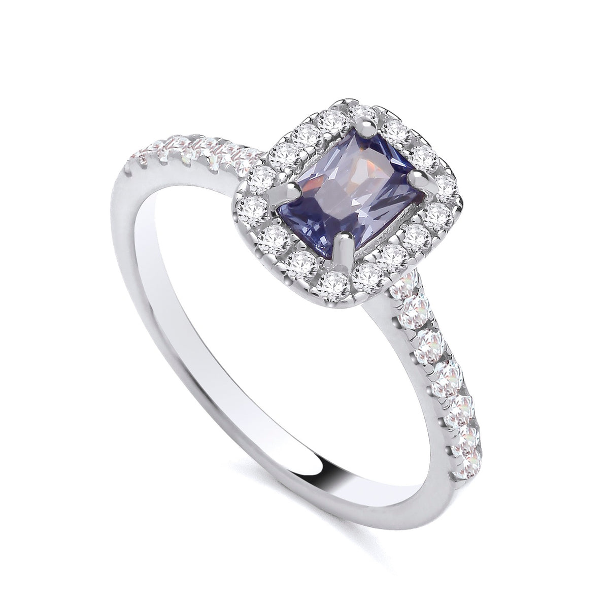 Sterling silver ring featuring a simulated tanzanite center and a cubic zirconia halo on a polished band.