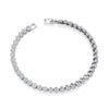 Silversmiths sterling silver tennis bracelet with round cubic zirconia clusters on a white background.