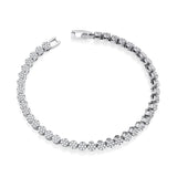 Silversmiths sterling silver tennis bracelet with round cubic zirconia clusters on a white background.