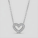 A double heart necklace with natural diamonds set in sterling silver, displayed against a plain background.