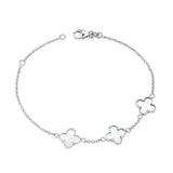 Sterling silver bracelet with three mother of pearl clover charms on a delicate, secure chain.