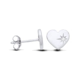 Sterling silver heart stud earrings with a starburst design and a clear cubic zirconia center stone.