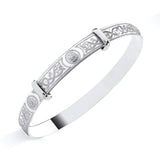 A Sterling Silver baby bangle by Silversmiths features an engraved Celtic knot motif, shown on a white background.