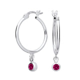 Silversmiths sterling silver hoop earrings feature simulated ruby charms and sparkling pink stones.