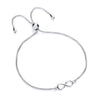 A sterling silver infinity bolo bracelet with a sliding clasp is displayed on a white background.