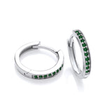 Sterling silver huggie hoop earrings with green simulated emerald stones on a plain white background.