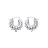 Sterling silver 15mm gypsy creole hoop earrings with spiked design and latch-back closure.