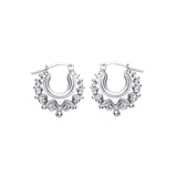 Sterling silver 15mm gypsy creole hoop earrings with spiked design and latch-back closure.