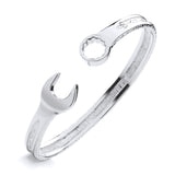 A silver men’s 7.2mm torque bangle features spanner and wrench terminals, displayed on a white background.