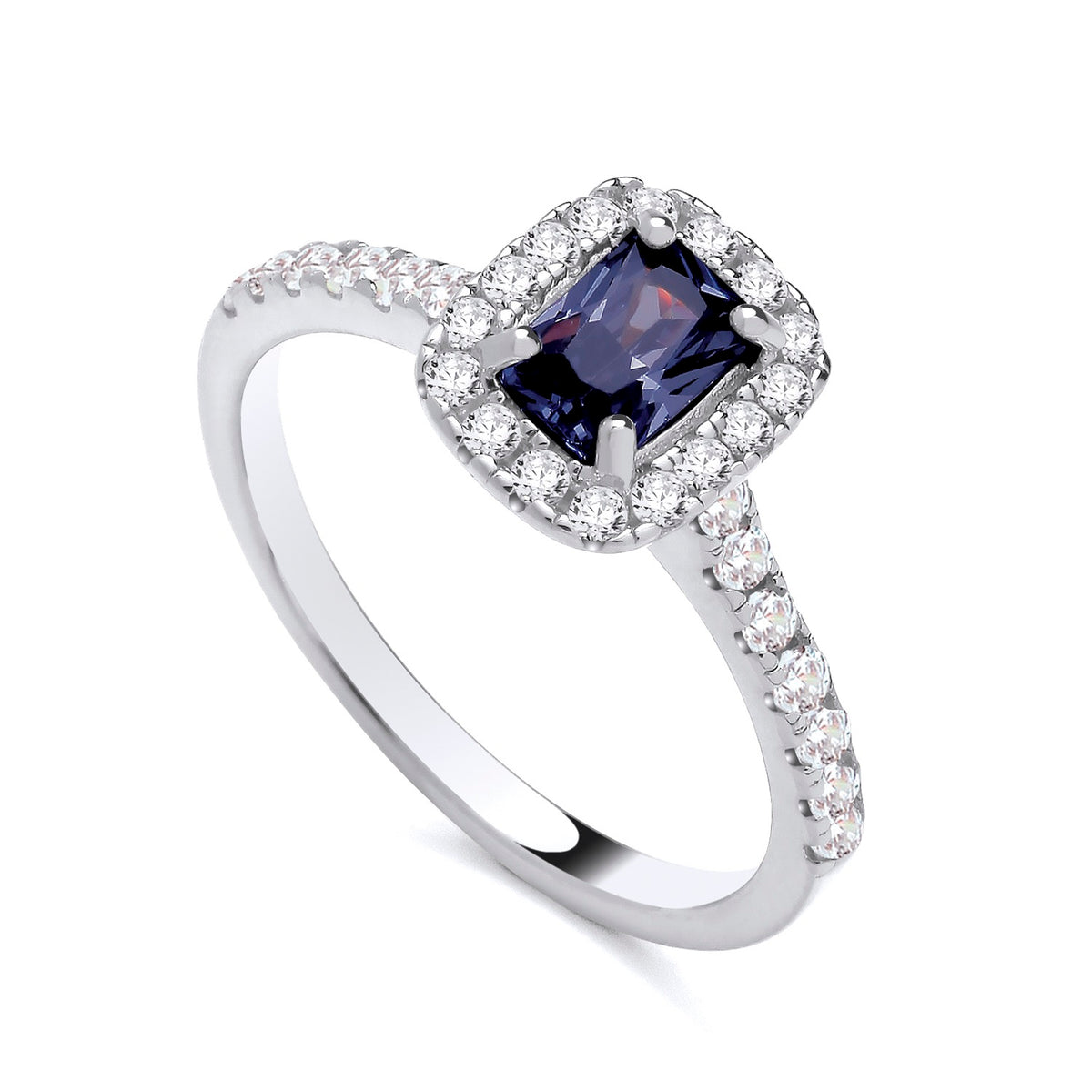 Sterling silver ring featuring a square simulated sapphire center and clear CZ halo accents by Silversmiths.