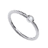 Sterling silver twisted band ring by Silversmiths with a solitaire cubic zirconia in a simple bezel setting.