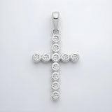 A sterling silver cross pendant by Silversmiths features round-set cubic zirconia, shown on a white background.