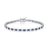 A sterling silver tennis bracelet with 3mm simulated sapphires and cubic zirconia, shown on a white background.