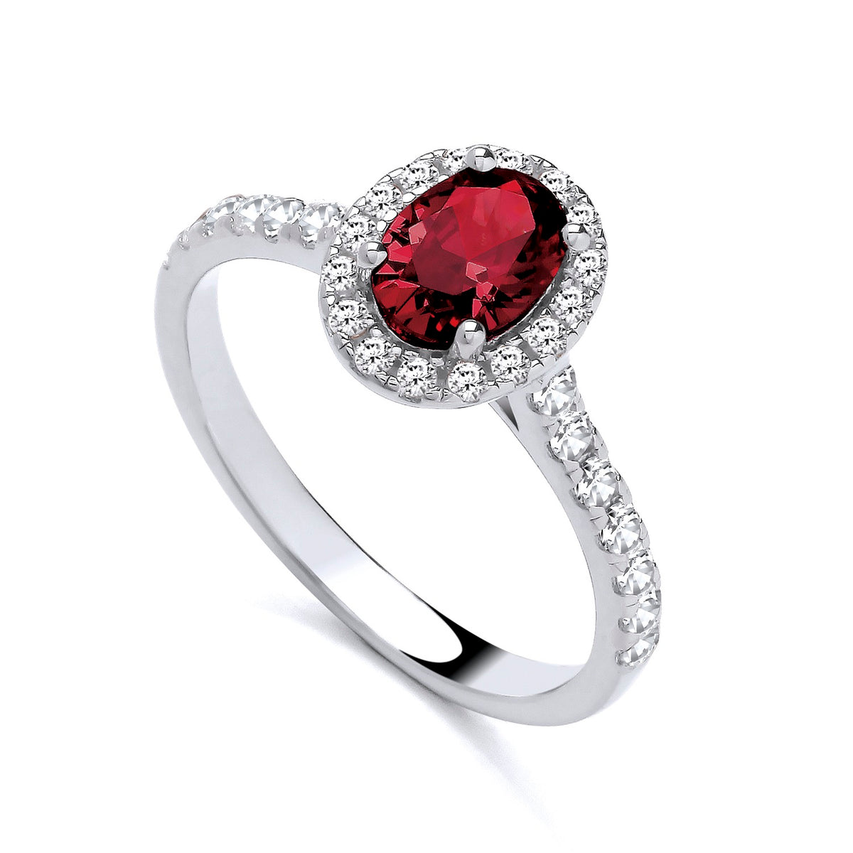 Sterling silver ring featuring a simulated ruby center, CZ halo, and sparkling stones set along the band.