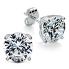 Sterling silver stud earrings featuring 8mm round cubic zirconia stones and classic butterfly backings.